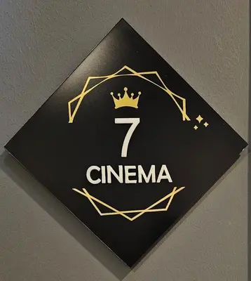 a black sign with a crown on a wall at Arts by Loulé - Alojamento de Charme in Loulé