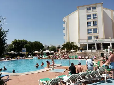 a group of people in the swimming pool at a hotel at Ourabay Hotel Apartamento - Art & Holidays in Albufeira