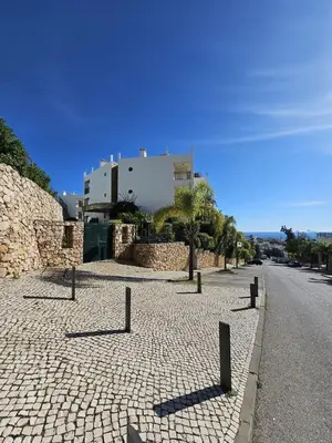 a cobblestone street with a building in the background at Colina do Atlântico 203 in Albufeira
