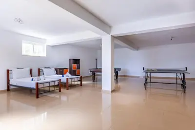 a living room with two couches and a pool table at Villa Lis in Galé