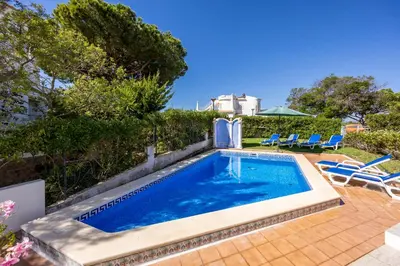a swimming pool in the backyard of a house at Villa Lis in Galé