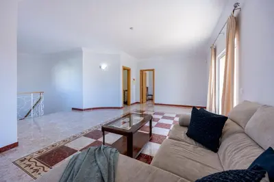 a living room with a couch and a glass table at Villa Lis in Galé