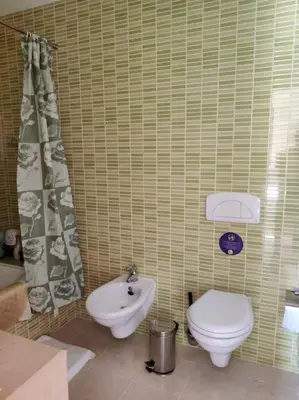 a bathroom with a toilet and a sink at 2 bedroom top floor apartment in Albufeira in Albufeira