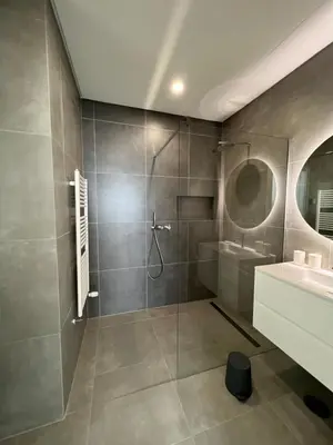 a bathroom with a shower and a sink at villagoldra rentals - Luxury and Family Villa in Goldra de Baixo