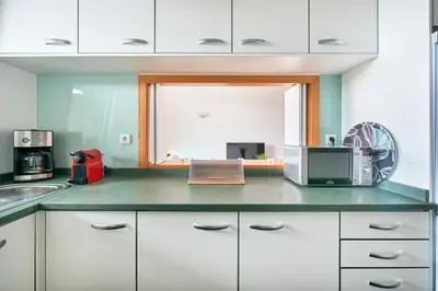 a kitchen with a counter top with a laptop on it at Residence Golf Club lovely Ap in Quarteira
