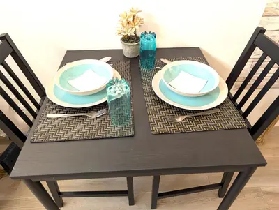 a black table with two plates on it at Grand Studio 31 in Faro