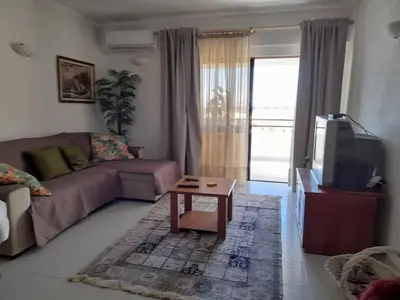 a bedroom with a ceiling fan and a bed at Modern apartment in Vilamoura with shared pool in Vilamoura