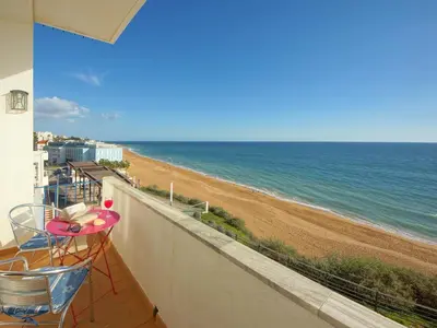 a balcony with a view of the beach at Inn The Beach Apartments by Seareen in Albufeira