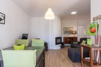 a living room with a couch and a table at LovelyStay - Green Oasis Villa in Vilamoura