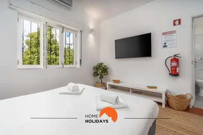 a bathroom with a shower and a toilet and a sink at #062 Villa Lemon 3 by Home Holidays in Albufeira