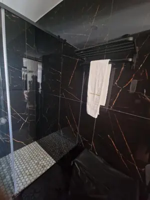 a bathroom with a sink and mirrors on the wall at RECANTO da FELICIDADE in Albufeira
