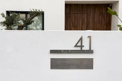 a courtyard of a house with a small garden at Villa 41 - Private Studios Faro Airport, Beach and City Center in Faro