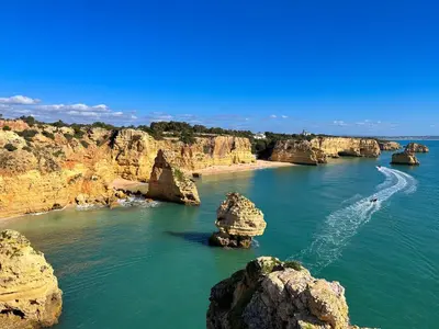 a river with some rocks in the water at Golden Palm Condo by BeCherish in Albufeira
