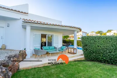 a bedroom with a large bed and a window at #239 Vivenda V3 com Piscina by Home Holidays in Albufeira