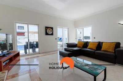 a living room with a couch and a table at #248 Villa Loureira 54 by Home Holidays in Albufeira