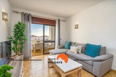 a living room with a couch and a table at #252 Bartolomeu Dias 7 by Home Holidays in Albufeira