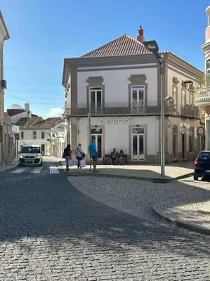 a group of people standing in front of a building at Castle House Loulé City Center in Loulé