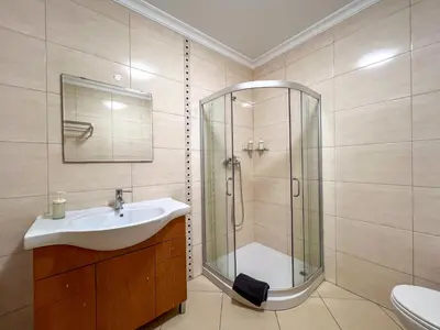 a bathroom with a glass shower and a sink at Charming 3-Bedroom Villa with Pool in Albufeira in Albufeira
