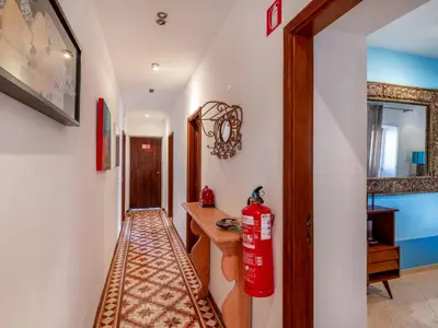 a bedroom with a bed with blue towels on it at Holiday Home Rocha by Interhome in Albufeira