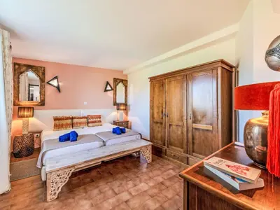 a bedroom with a bed and a wooden cabinet at Holiday Home Antonica by Interhome in Patroves