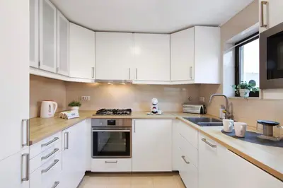 a kitchen and dining room with a table and chairs at Cool Motion 2149 in Albufeira