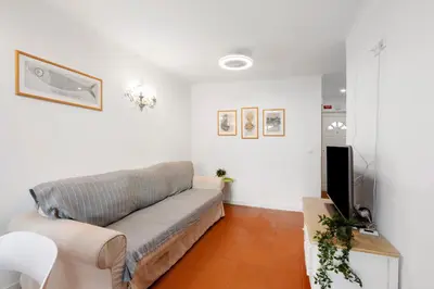 a white kitchen with white cabinets and a sink at Cool Motion 2149 in Albufeira