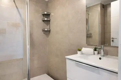 a bathroom with a shower and a sink at Magnificent Beach Apartment in Albufeira