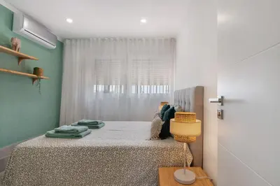 a bedroom with a bed and a window at Stunning Modern Apartment In Oura in Albufeira