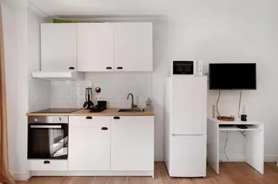 a living room with a couch and a table at Lovely And New Apartment In Oura in Albufeira