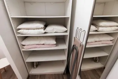 a walk in closet with pillows and a mirror at Sea View Apartment Faro in Faro