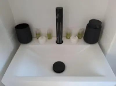 a white counter with two speakers and candles on it at Balaia Praia in Albufeira