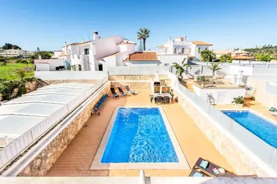 an aerial view of a villa with two swimming pools at Villa Felizalgarve in Albufeira