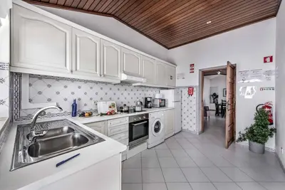 a living room with a couch and a table at Villa Rum Cay in Albufeira