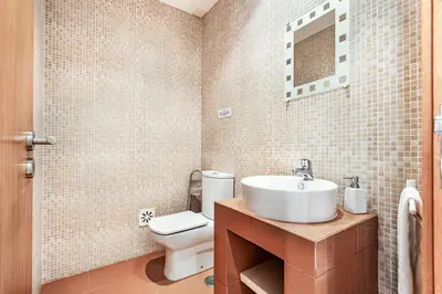 a bathroom with a sink and a toilet at Villa Casa Sol in Albufeira