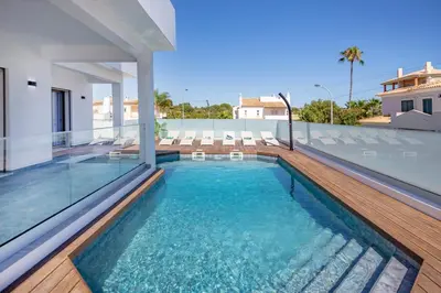 a swimming pool on the roof of a house at Crystal bay in Albufeira