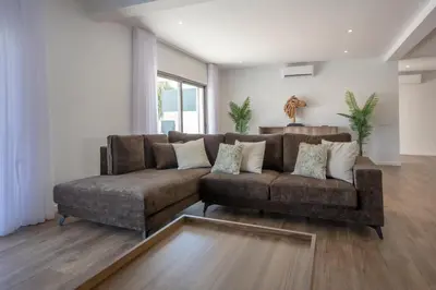 a living room with a couch and a table at Crystal bay in Albufeira