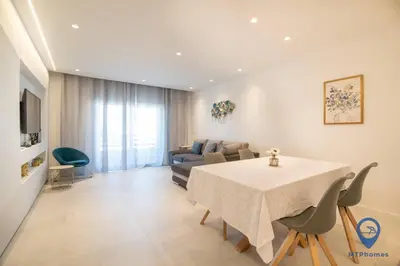 a kitchen with a counter with a clock on the wall at Vale Mangude B by MTPhomes in Albufeira