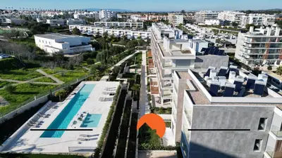 an aerial view of a city with buildings and a swimming pool at #264 Green Apartments C04 by Home Holidays in Albufeira