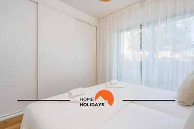 a room with a bed with a have holidays sign on it at #264 Green Apartments C04 by Home Holidays in Albufeira