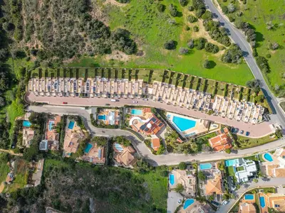 an aerial view of a complex with buildings and a road at Townhouse Ocean Joy by Algarve Vacation in Albufeira