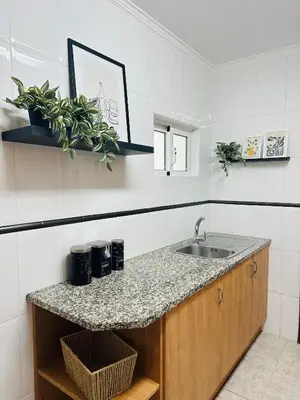 a kitchen with a sink and a counter at Appartement Talia in Albufeira