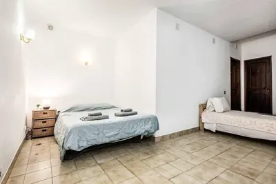 a dining room with a table and chairs and a window at Villa Serenity in Albufeira