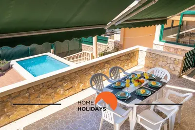 a table with eggs on it next to a pool at #257 Villa Sun & Sea by Home Holidays in Albufeira