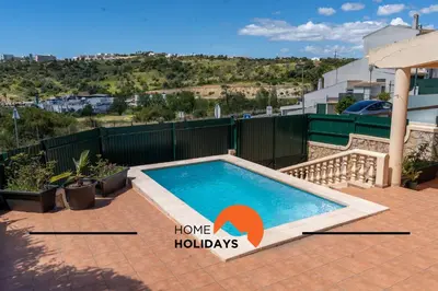 a swimming pool on top of a house at #257 Villa Sun & Sea by Home Holidays in Albufeira