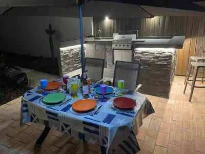 a table with plates and glasses on top of it at Ville Verde in Loulé