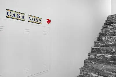 a sign that reads casa north next to a staircase at Faro Nony Apartment by Get Your Stay in Faro