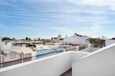 a view of the city from the roof of a building at Faro Nony Apartment by Get Your Stay in Faro