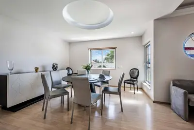 a dining room with a table and chairs at Villa Dourado in Boliqueime