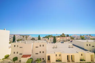 a view of a building and a parking lot at SeaView apartment by MOJE Holiday in Albufeira