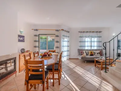 a kitchen and dining room with a table and chairs at Holiday Home V3 Aguia M - VIP Properties by Interhome in Albufeira